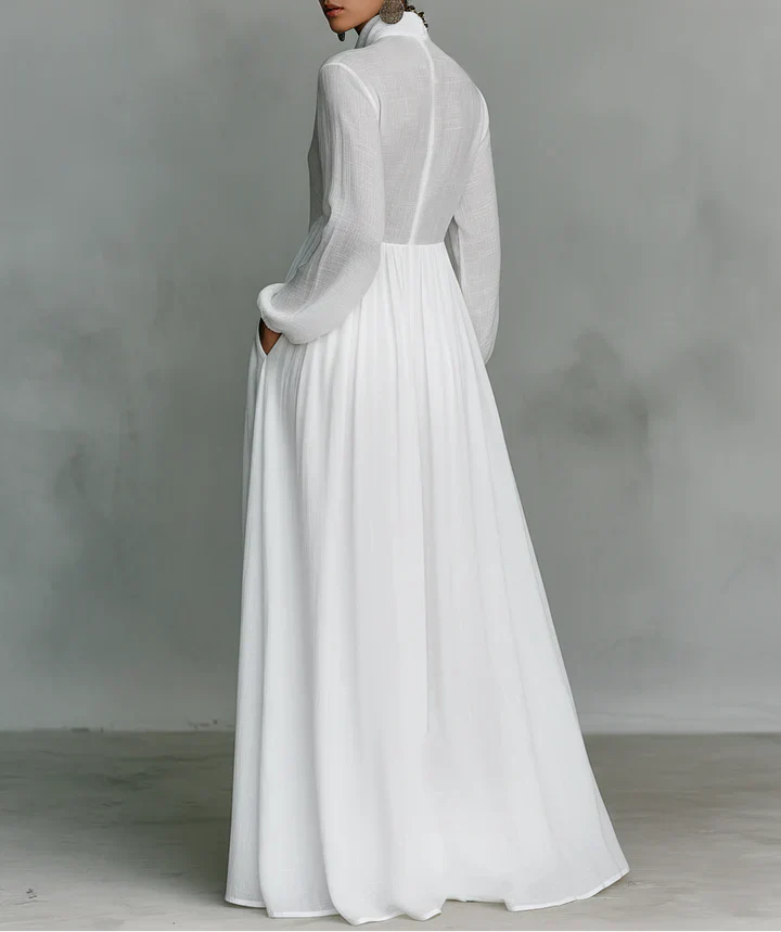 Maxi minimalista de algodón y lino con patchwork, cuello alto y mangas largas