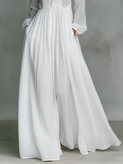 Maxi minimalista de algodón y lino con patchwork, cuello alto y mangas largas