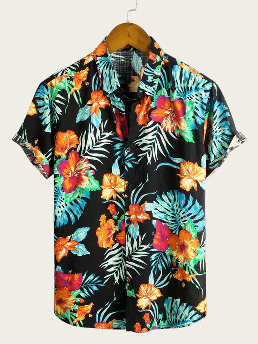 Camisa hawaiana de manga corta Victoria Lemaire con estampado floral tropical en negro, naranja y azul. Tejido de algodón ligero.