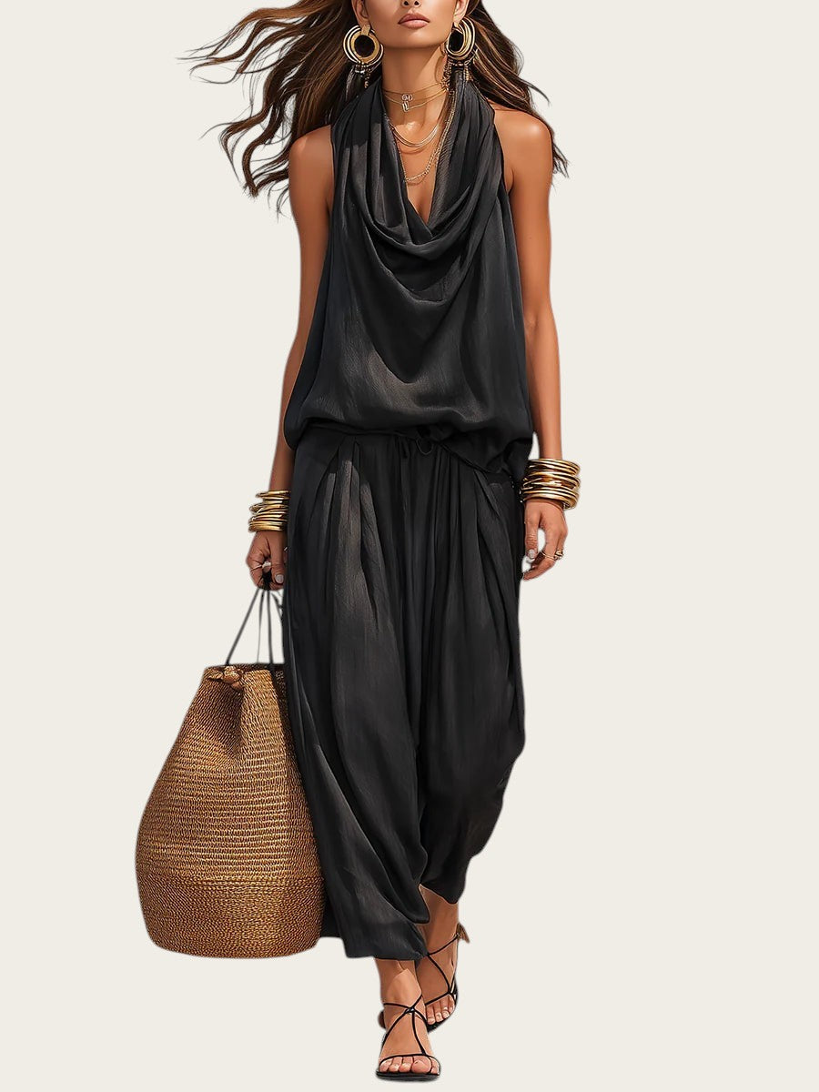 Conjunto negro de dos piezas Victoria Lemaire con top halter drapeado y pantalones anchos fluidos.