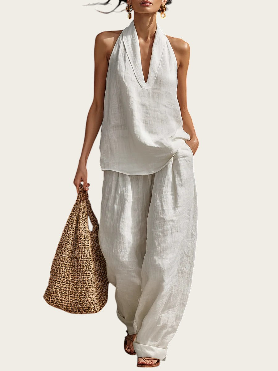 Conjunto blanco de lino de Victoria Lemaire con top sin mangas y escote en V y pantalón de pierna ancha.