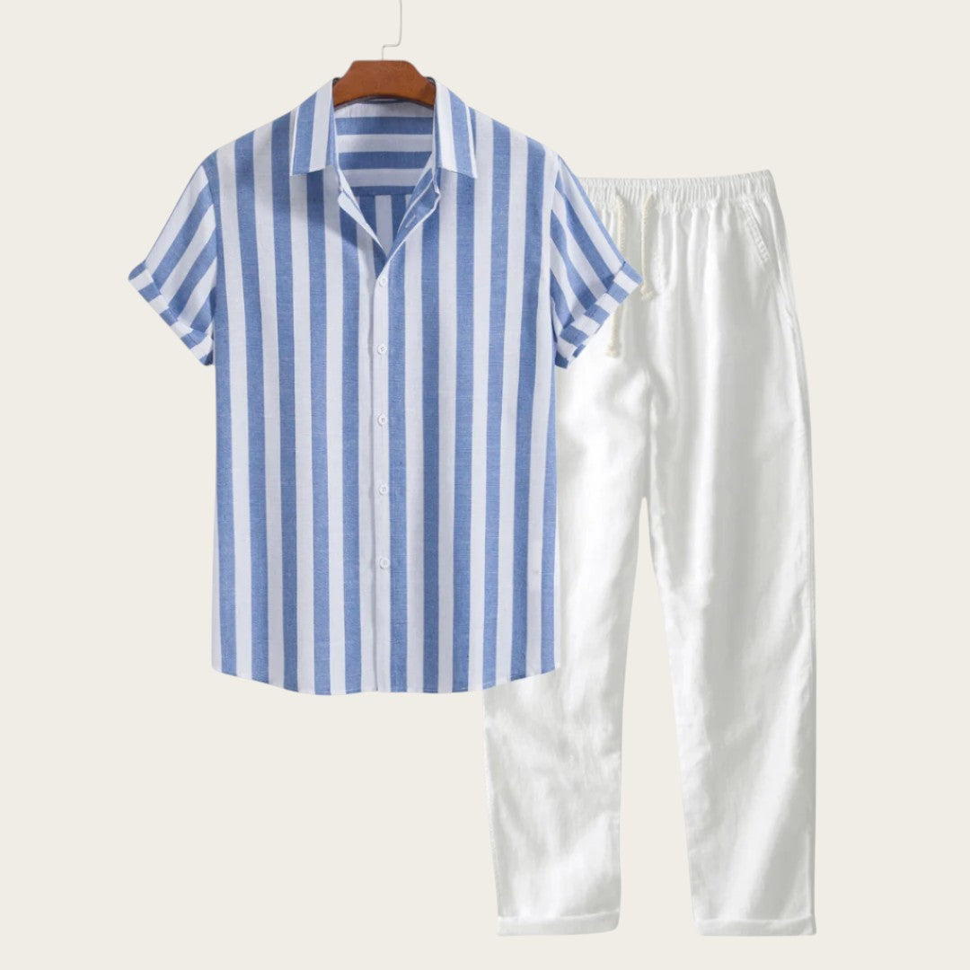 Conjunto de verano AMALFI de Victoria Lemaire: camisa de rayas azules y blancas de poliéster y lino, pantalones blancos de algodón y lino.